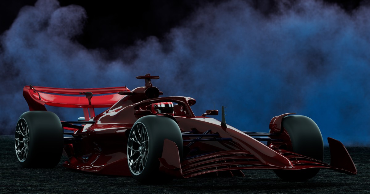 A red sports race car stands against a dark background surrounded by smoke, providing a contextual ambiance.